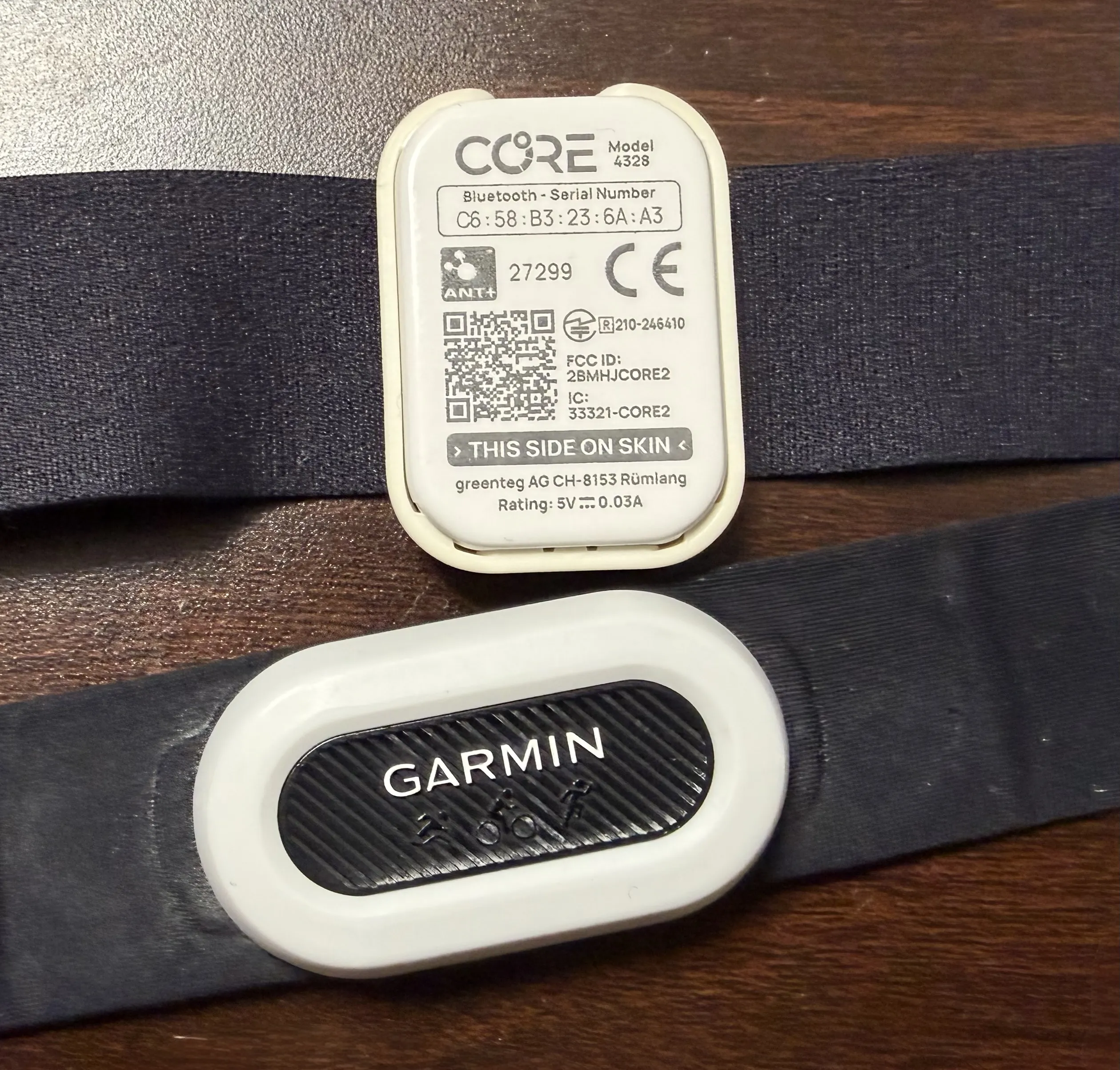 CORE sensor (top) and Garmin HRM chest strap (bottom) — the CORE clips onto the strap
